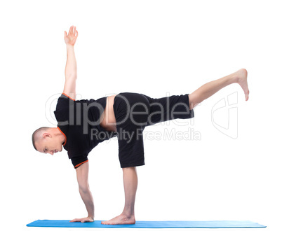 Yoga. Image of middle-aged man posing in studio