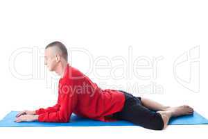 Flexible middle-aged man meditates in studio