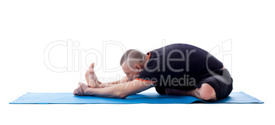 Middle aged man doing workout on gymnastic mat
