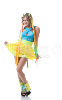 Cute Slavic girl posing in colorful national dress
