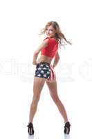 Playful slim woman posing in patriotic costume