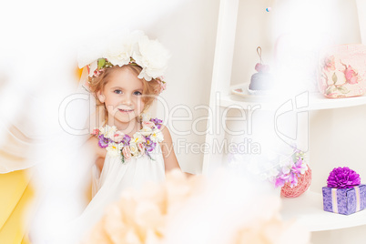 Image of adorable girl posing in floral wreath