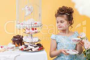 Smartly dressed little lady drinking tea