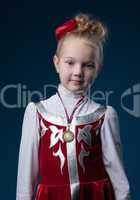 Pretty little sporty girl posing with medal