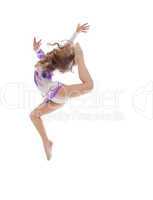 Graceful little artistic gymnast posing in jump