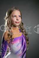 Portrait of little curly artistic gymnast