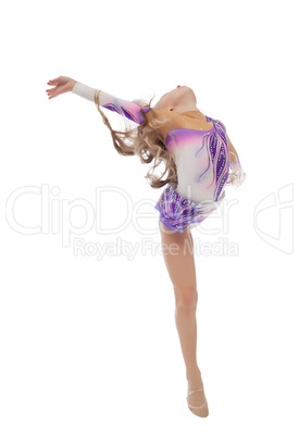 Flexible cute little gymnast posing in studio