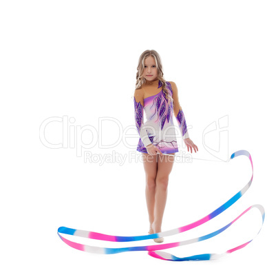 Athlete rhythmic gymnastics performs with ribbon