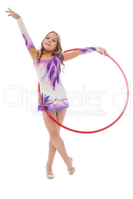 Young artistic athlete performs with hula hoop