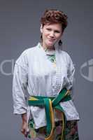 Stylish middle aged woman posing in sports kimono