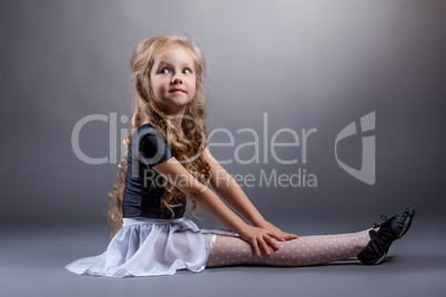 Adorable dancer posing in costume for performances