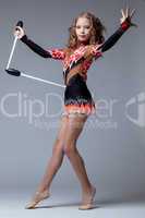 Fancy artistic gymnast dancing with mace