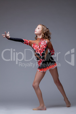 Image of artistic young girl dancing in studio