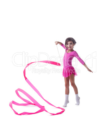 Adorable little gymnast dancing with ribbon