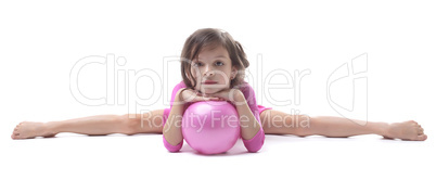 Image of adorable little gymnast doing split