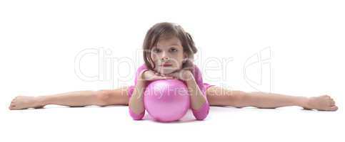 Image of adorable little gymnast doing split