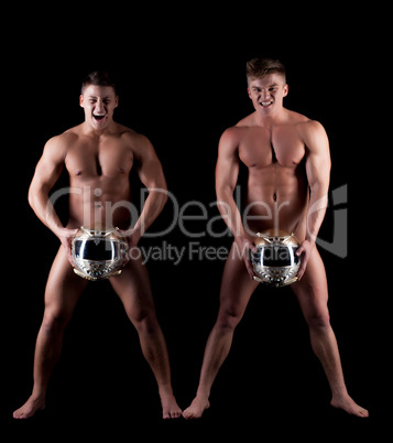 Image of emotional naked men posing with helmets