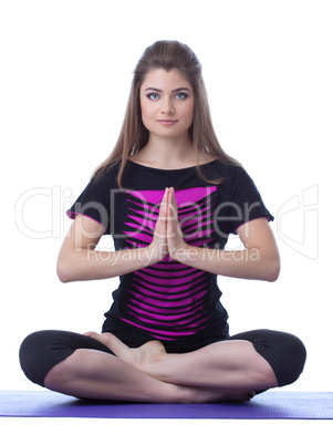 Studio shot of beautiful brunette practicing yoga