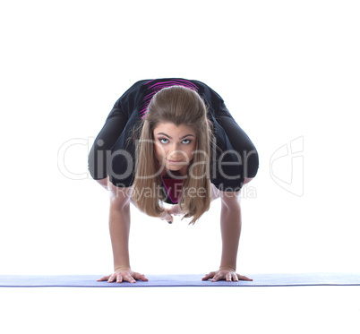 Sensual brunette posing in difficult yoga pose