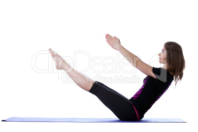 Smiling flexible yogi balancing in studio