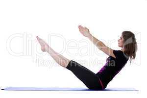 Smiling flexible yogi balancing in studio