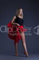 Pretty sensual woman dancing with red cloth