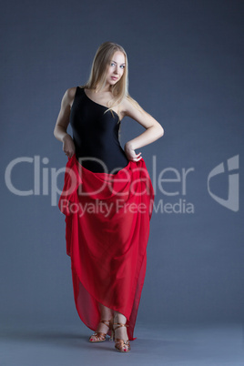 Attractive slim woman posing with red cloth