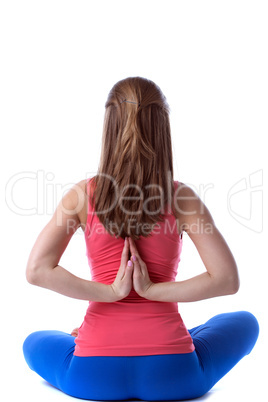 Rear view of slim woman practicing yoga