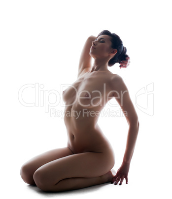 Studio shot of sensual young naked brunette