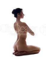 Image of pretty slim girl posing nude in studio