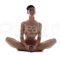 Image of relaxed naked woman meditates in studio