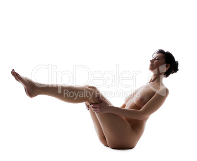 Pretty naked girl doing yoga, isolated on white