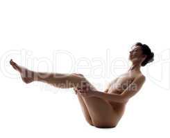 Pretty naked girl doing yoga, isolated on white