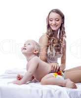 Beautiful young mother playing with her son