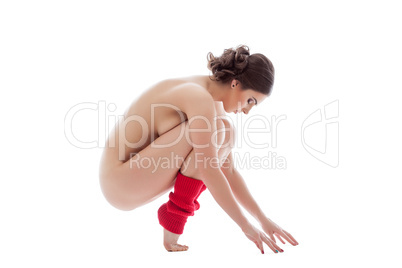 Image of graceful naked dancer posing in gaiters