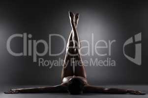 Image of slim nude woman posing lying in studio
