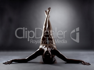 Silhouette of excited naked woman with slim legs