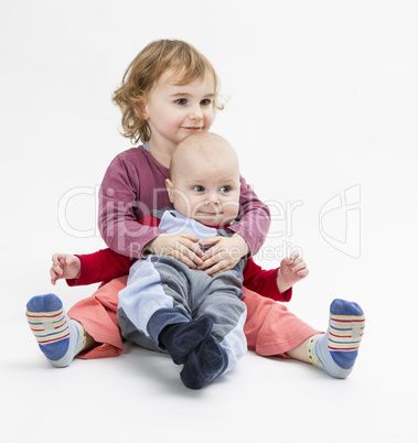 siblings isolated in light background