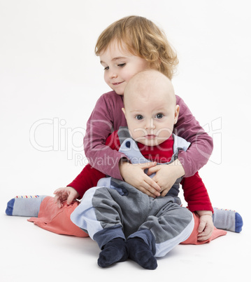 siblings isolated in light background