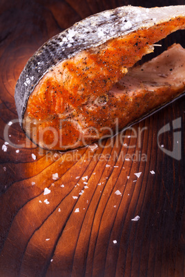 grilled salmon steak on wood