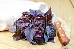 Basil purple with a knife on board
