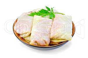 Cabbage stuffed with parsley in a dish