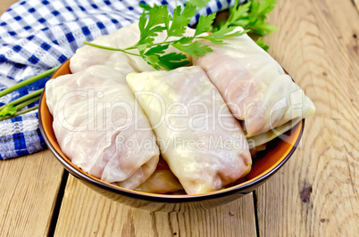 Cabbage stuffed with parsley on the board