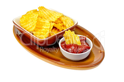Chips in tomato sauce on a clay plate