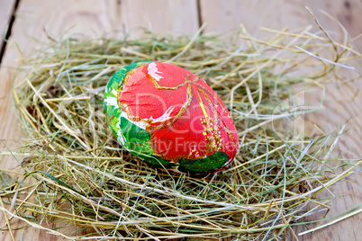Easter egg with red flower on board