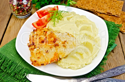 Fish fried with mashed potatoes on napkin