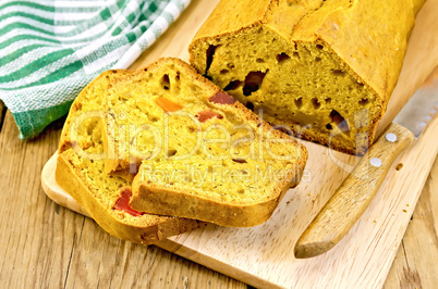 Fruitcake pumpkin with candied fruit and knife