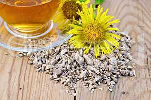 Herbal tea from the root of elecampane with cup and flower