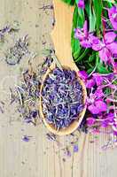 Herbal tea of fireweed on wooden spoon