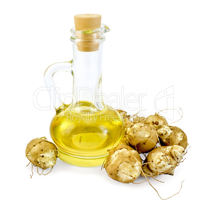 Jerusalem artichokes with a carafe of oil